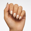 Hand with beige nail polish on a white background