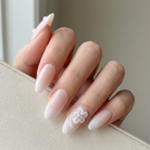 Nail with a floral design on a neutral background